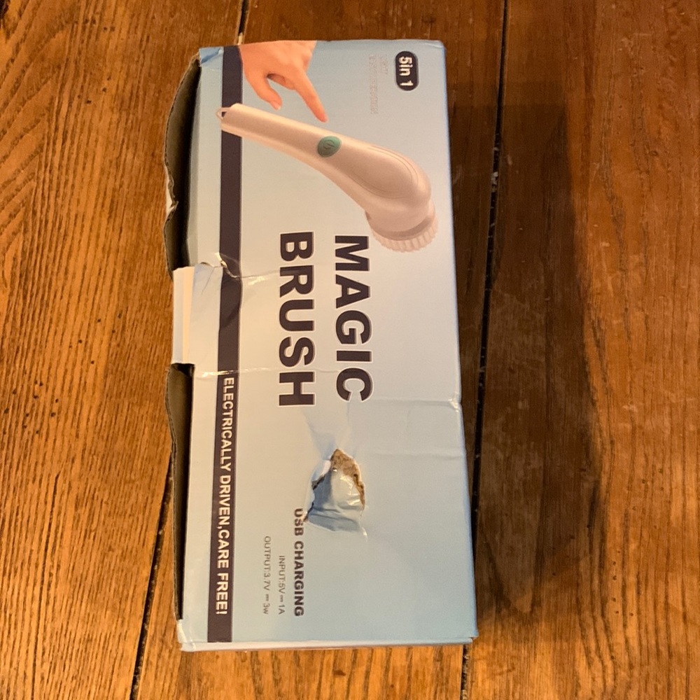 New in box Magic Scrubbing Brush, 5 in 1. Box a bit damaged